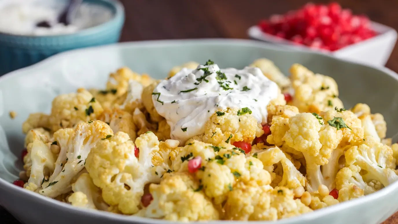 Garlic Roasted Cauliflower with Pomegranate and Pine Nuts