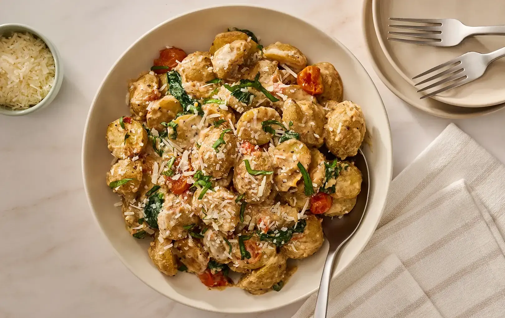 Cacio e Pepe Roasted Potatoes & Tomatoes with Wilted Spinach