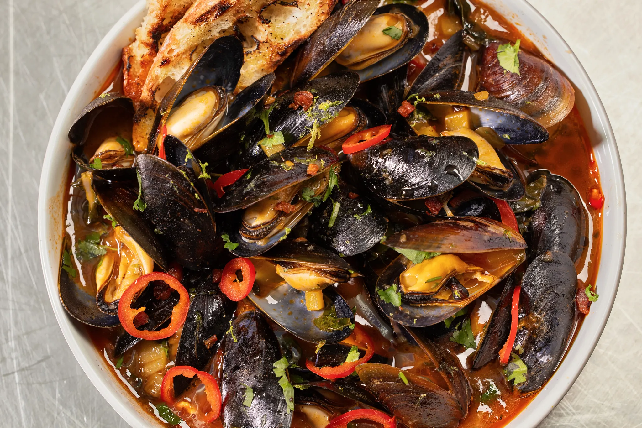 Steamed Mussels with Spicy Mango White Wine Broth